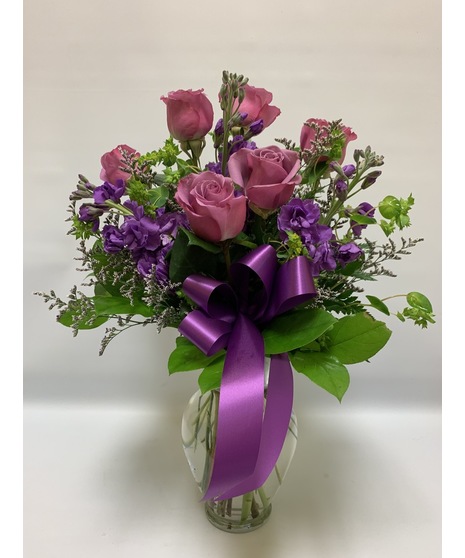 lavender roses, stock, caspia and ribbon  with salal in clear glass vase for a unique gift